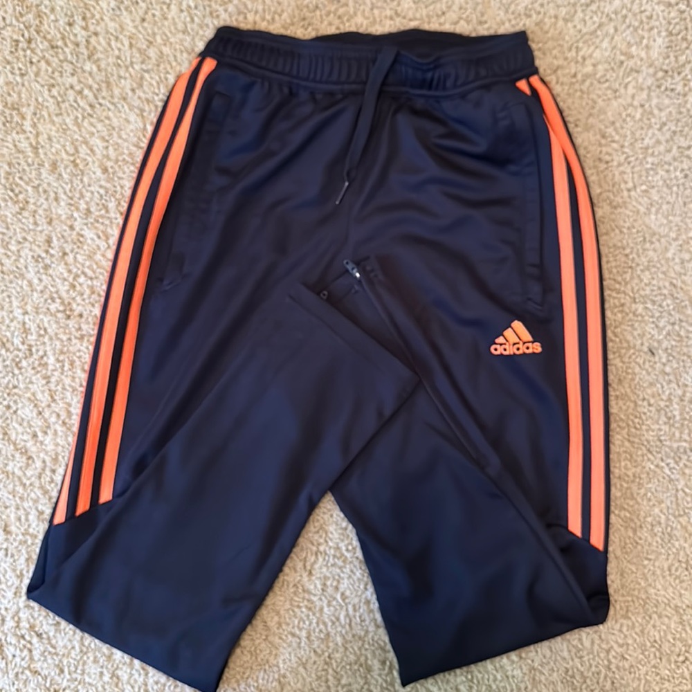 Navy blue and orange accent, Adidas boys sweatpants.